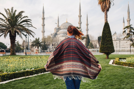 Woman enjoy beautiful view on Sultanahmet Blue Mosque , famous islamic Landmark mosque, Travel to Istanbul, Turkeyの写真素材