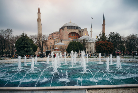 Turkey, Istanbul - March 31, 2017: Woman enjoy beautiful view on Hagia Sophia Cathedral, famous islamic Landmark mosque, Travel to Istanbul, Turkeyのeditorial素材