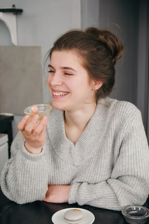 Teenager taste green tea on chinese ceremony in cafe. Positive girl portrait and relax atmosphereの写真素材