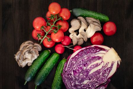 Vegetable in reusable bags on wood background, top viewの写真素材