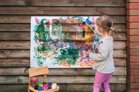 Beautiful little girl paintingの写真素材
