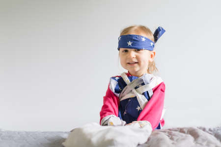 Little girl playing games and having fun at homeの写真素材