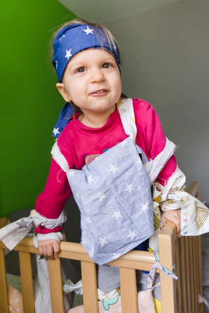 Little girl playing games and having fun at homeの写真素材