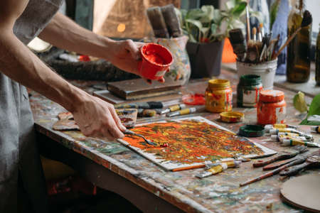 Painter in workspace creating modern artの写真素材