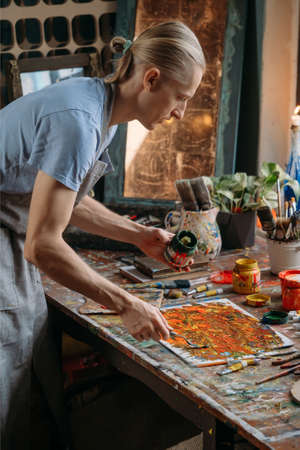 Painter in workspace creating modern artの写真素材