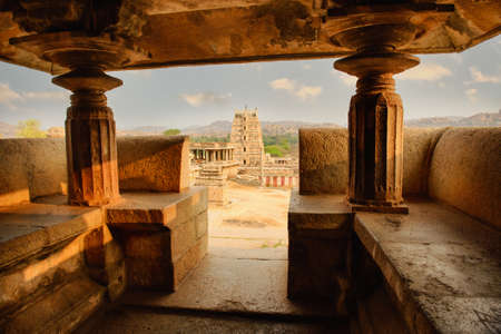 Unbelievable ancient temple ruins in Hampi at sunset, Indiaの写真素材