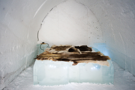 igloo interior with an ice bed and animal skin