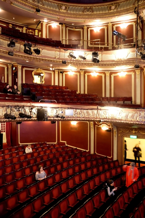 Interior of Apollo theatre, shaftsbury Avenue, London, UK, rows of red velvet seats seats and stalls on different levels, black and whiteのeditorial素材