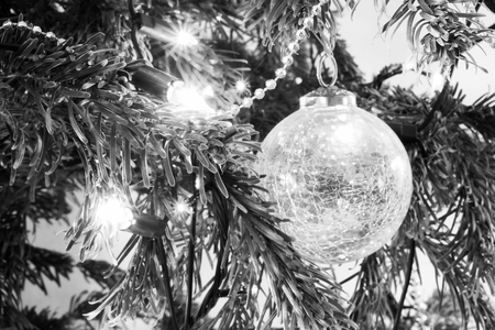 close up of lights and bauble on a christmas treeの写真素材