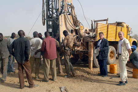 All stages of the drilling of a well in Burkina Faso Faso. Water is with 40 meters of depth and it is necessary to use a truck of drilling. To final manual pump will be assembled so that the well is protected from all pollution outside. A well costs 8000 のeditorial素材