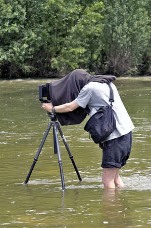 Cardet - France - May 18th, 19th and 20th, 2013 - European Cup of the gold diggers in river. photographer in nature with photographic equipment large size of studioのeditorial素材
