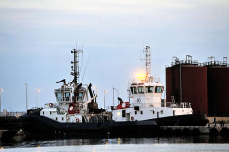 Tug boats with quay for the evening in a creek of Fos on Sea beside Marseille 
