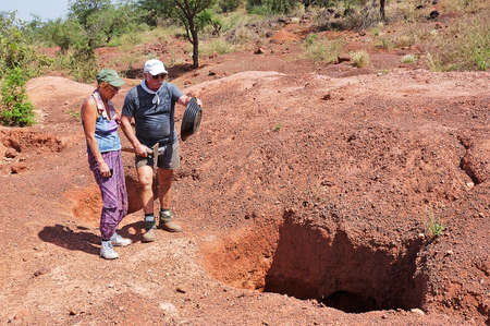 two French gold prospectors are impressed by the work of African gold miners in Burkina Fasoのeditorial素材