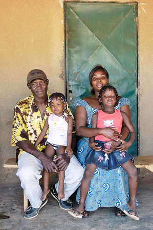 portrait of an African family outside his home in Ouagadougouのeditorial素材