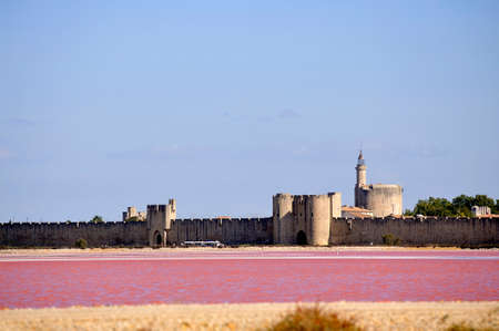 The ramparts of the walled city of Aigues-Mortes seen pink saltの写真素材