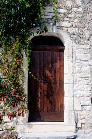 Front door of an old wooden house in the village of Vezenobres in the French department of Gardのeditorial素材