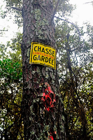 Panel in the forest indicating indication has private game reserveの写真素材