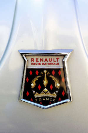 Logo Renault 1960 on the hood of a gray Dauphine Gordini photographed vintage car rally on City Hall Square in the city of Ales in the Gard department.のeditorial素材