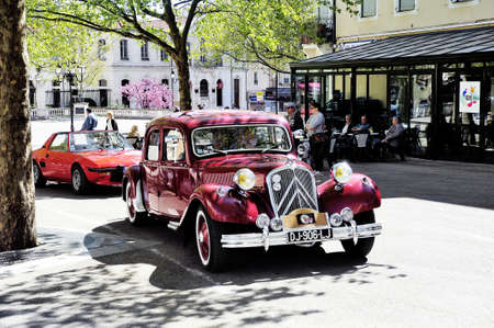 Citroen front-wheel Drive red photographed vintage car rally Town Hall Square in the town of Ales