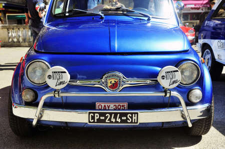 Old Fiat 500 Abarth racing equipped photographed vintage car rally Town Hall Square in the town of Alesのeditorial素材