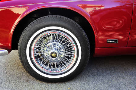 Spoked wheel of a Jaguar XJ photographed gathering of old cars Town Hall Square in the town of Ales,...