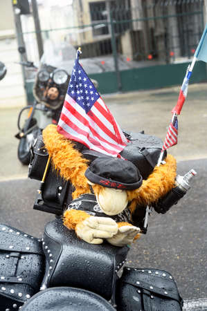 A motorcycle with a stuffed monkey parked at a gathering of American motorcycles in Beaucaire in the French department of Gardのeditorial素材