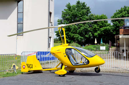 Gyroplane parked at the foot of the control tower of the aerodromeのeditorial素材