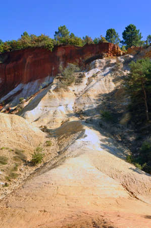 red landscape dug by six generations of miners ocher Colorado Provencal at Rustrel in the south of...