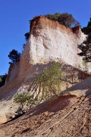 red landscape dug by six generations of miners ocher Colorado Provencal at Rustrel in the south of...