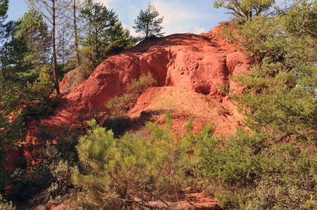 red landscape dug by six generations of miners ocher Colorado Provencal at Rustrel in the south of...