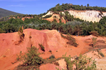 red landscape dug by six generations of miners ocher Colorado Provencal at Rustrel in the south of Franceの写真素材