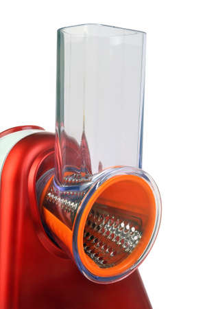 Small electric household appliances for raping and cutting vegetables photographed on white backgroundの写真素材