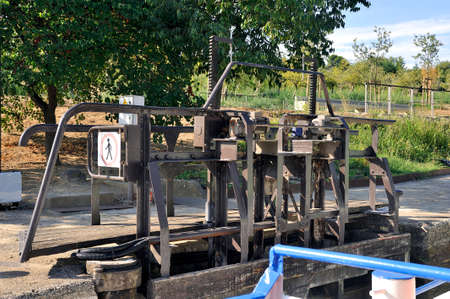 Passage of a lock to Fonserannes on the Canal du Midi near beziers by a cruise shipの写真素材