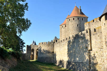 Fortified city of Carcassonne and its ramparts dating from the Middle Ages located in the French...