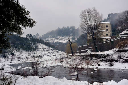 Le Gardon snowy river in the French region of Cevennes and the Gard department next to Anduzeの写真素材