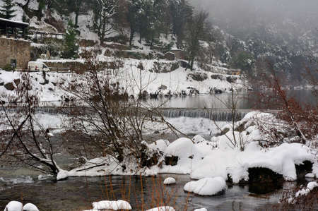 Le Gardon snowy river in the French region of Cevennes and the Gard department next to Anduzeの写真素材