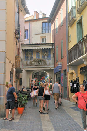 A small street in Collioure with colorful houses and souvenir shopsのeditorial素材