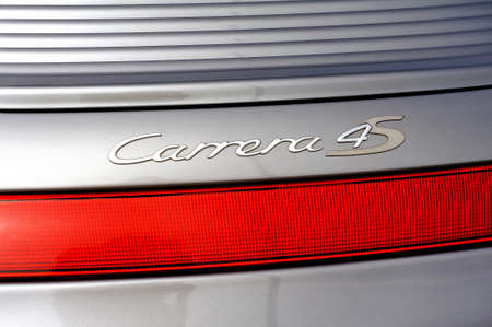 back detail on the Carrera 4s logo of a sports car Gray porche on a parking lot of the city of Ales in the Gard departmentのeditorial素材