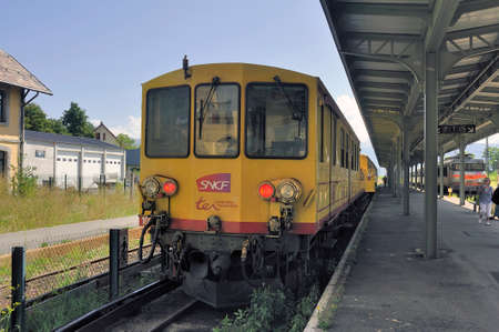 Small yellow train regional train TER of Languedoc Roussillon which crosses the Pyrenees in Latour station of Carol which is the terminusのeditorial素材