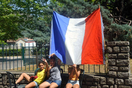 Tour de France supporters and their French flag in Anduzeのeditorial素材