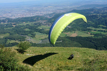Paragliders in full flight over volcanoes of Puy de Dome in the central massif near Clermont-Ferrandのeditorial素材