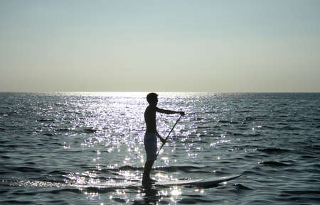 Stand up Paddle surfing in the bay of Palma Novaの写真素材
