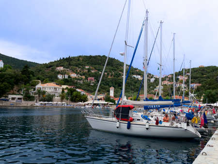A row of yachts docked on the Island of Ithaca in Greeceのeditorial素材