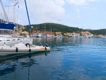 Yachts moored in the bay of Fiskardo on the Island of Kefalonia in Greeceのeditorial素材