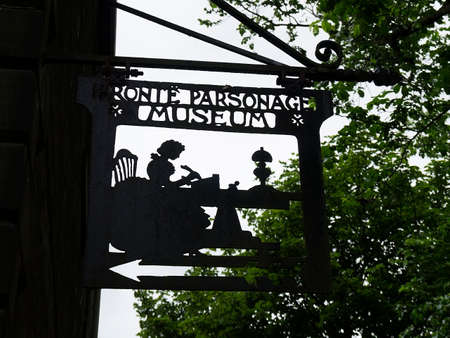 The Sign outside the Museum of the old Parsonage, in the Yorkshire village of Haworth where the Bronte sisters grew upのeditorial素材