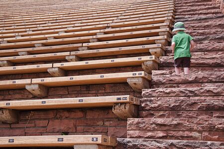 Little Boy Climbing Steps at Red Rocks