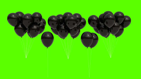Bunch of cut-out black balloons. Neutral green background.の写真素材