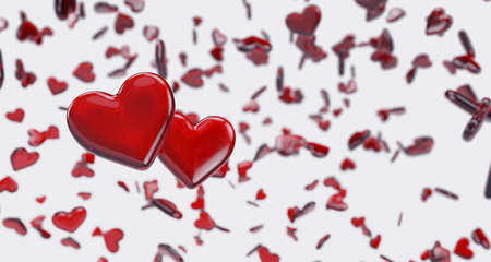 Candy hearts flying in the air on white backgroundの写真素材