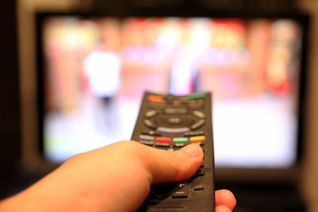 Watch a TV show while zapping.の写真素材