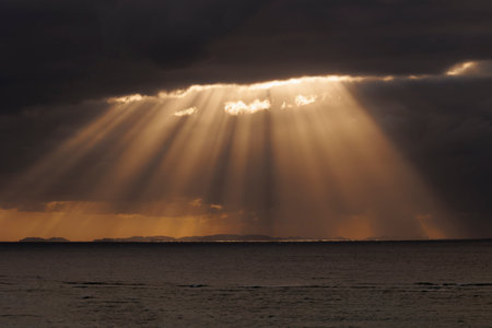 the light of the sun emitted through the thick clouds